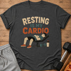 Dark grey t-shirt with "Resting is my cardio" text and sleeping man graphic.