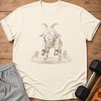 Crying goat with horns and beard lifting a barbell on a tan t-shirt.