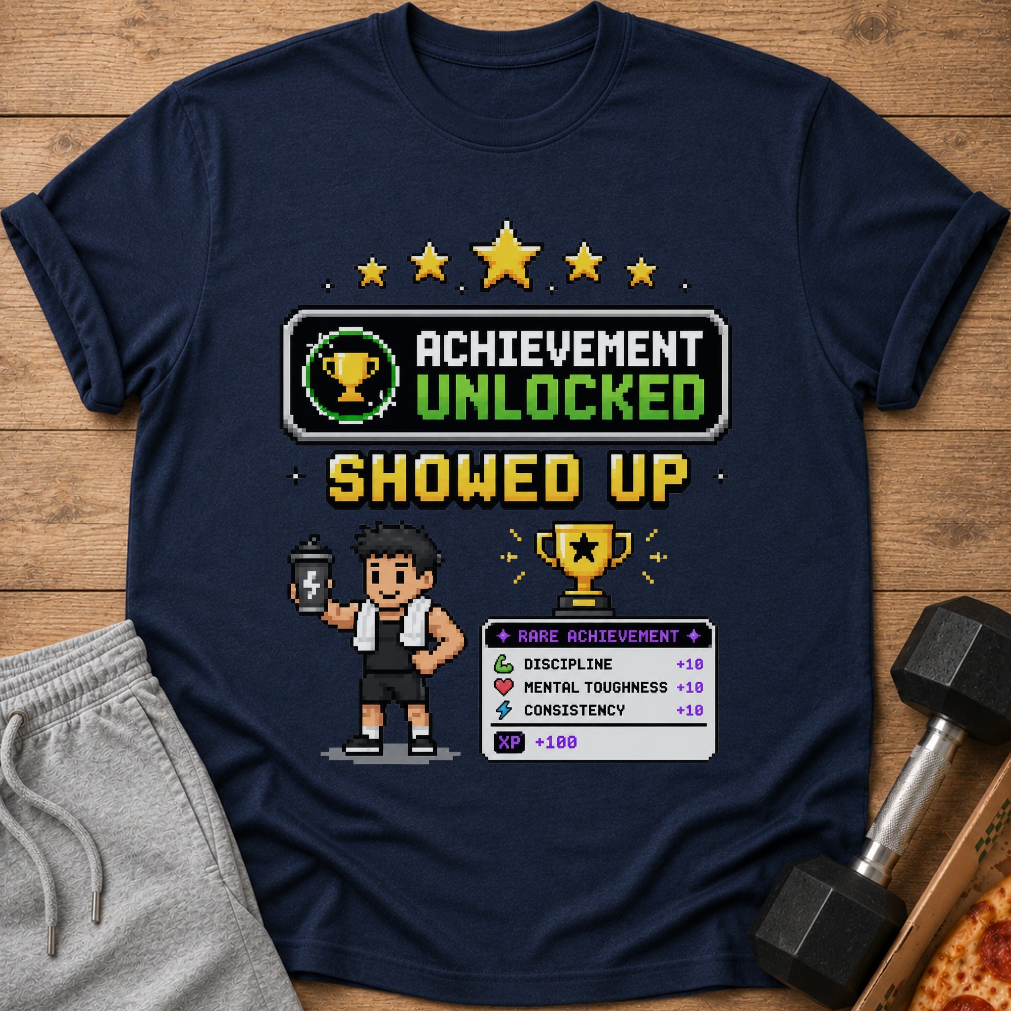 Navy t-shirt with pixel art "Achievement Unlocked Showed Up" and fitness stats.