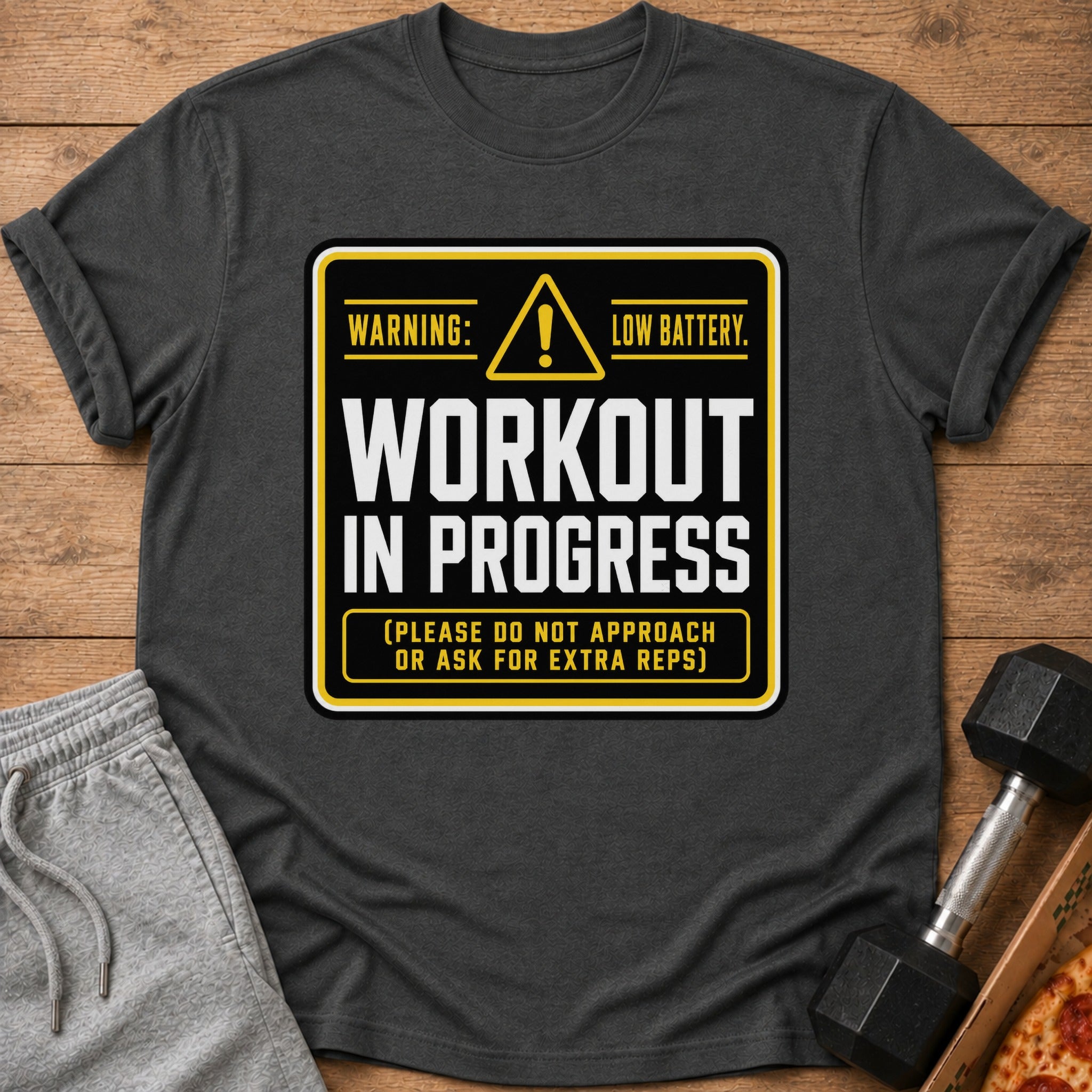 Dark gray t-shirt with "Warning: Low Battery. Workout in Progress." text.