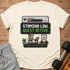 Cream t-shirt with "Stamina Low. Quest Active." pixel art.