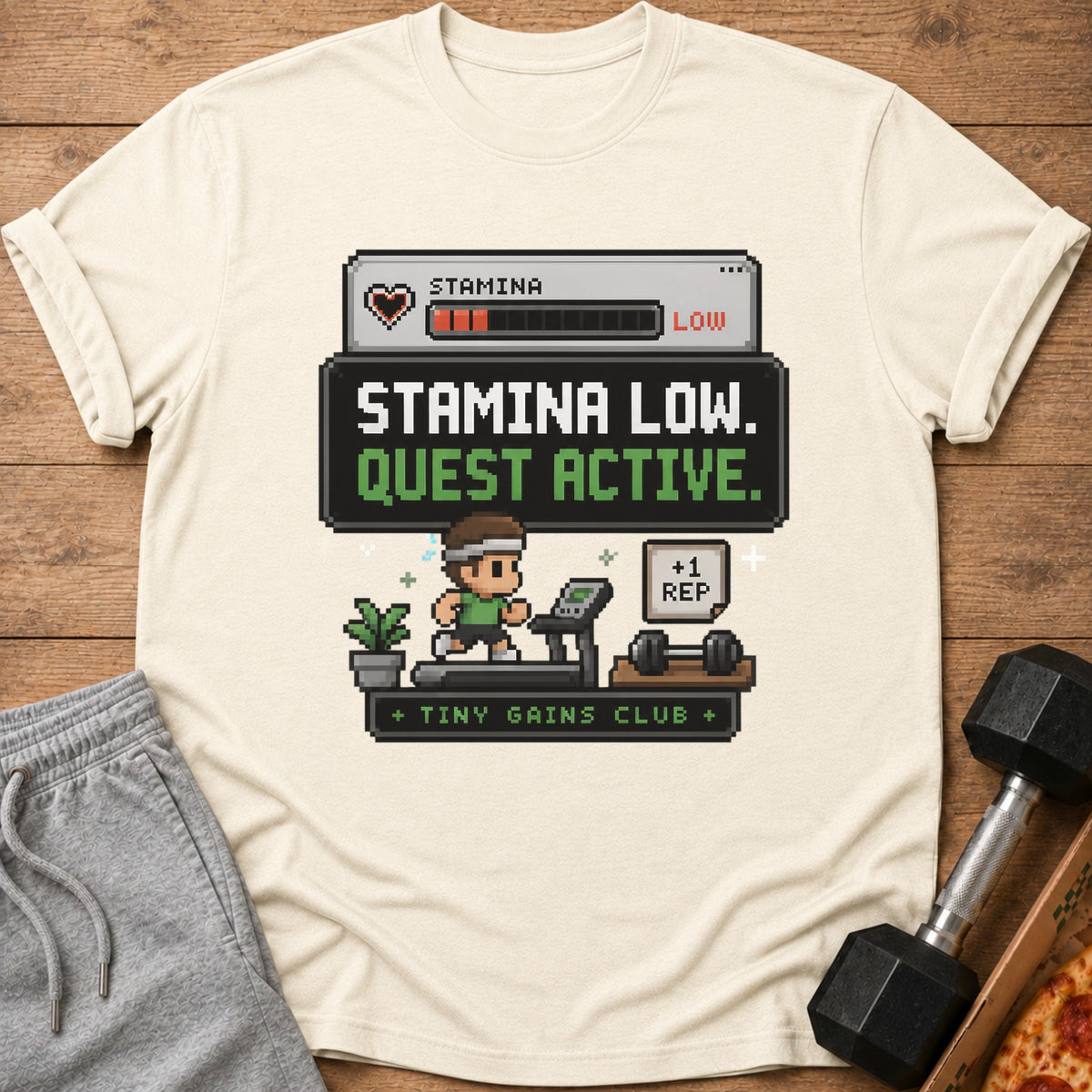 Cream t-shirt with "Stamina Low. Quest Active." pixel art.