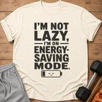 Light-colored t-shirt with "I'M NOT LAZY, I'M ON ENERGY-SAVING MODE." text.