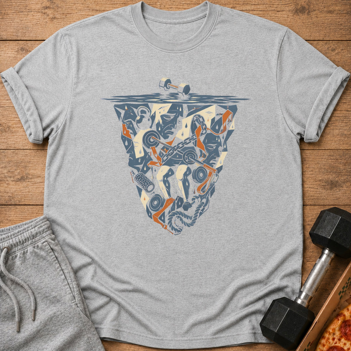 Gray t-shirt with a graphic shield of gym equipment and sweating faces.