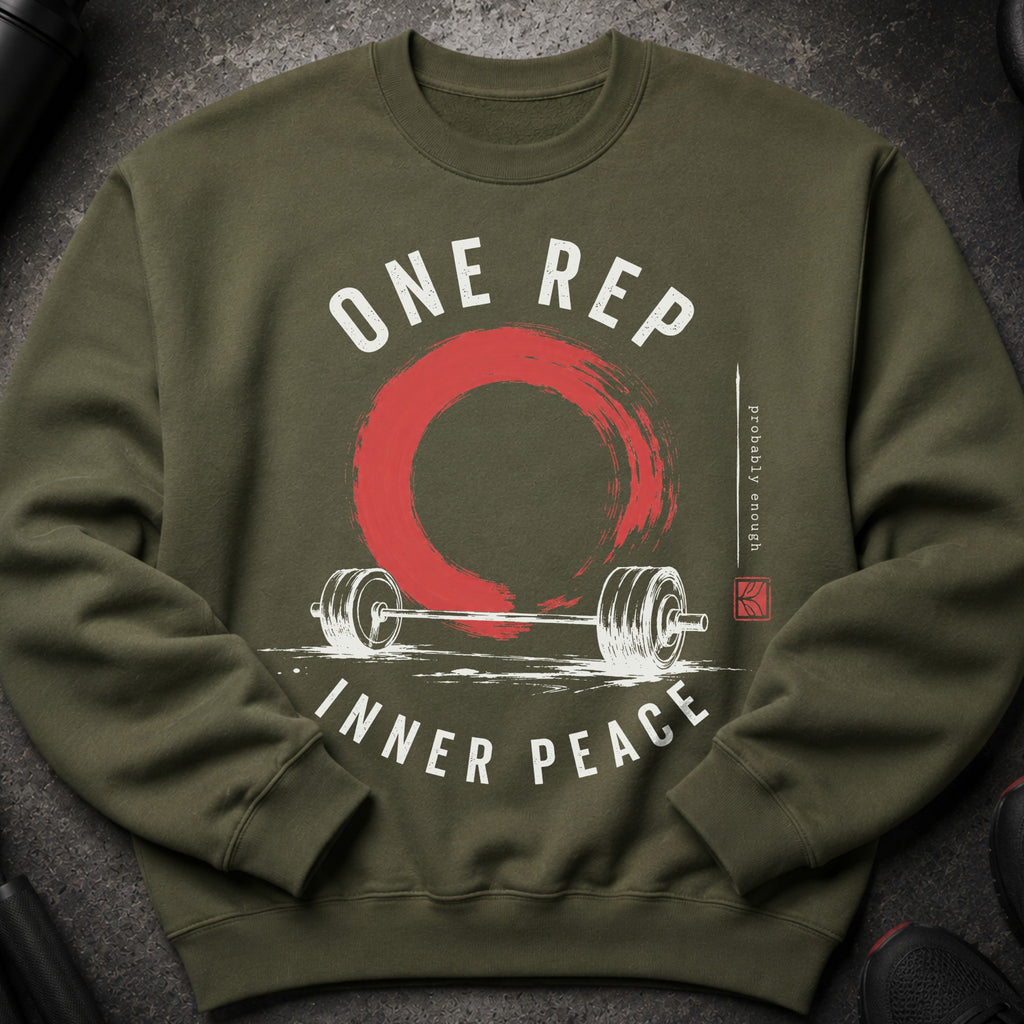 Olive green sweatshirt with white text "ONE REP INNER PEACE" and barbell graphic.