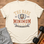 Cream t-shirt with "The Bare Minimum Club" text, sloth graphic, and "Doing Just Enough".