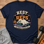 T-shirt graphic with ghost, gym equipment, and text "REST IN REPS LOW ENERGY AFTERLIFE CLUB."