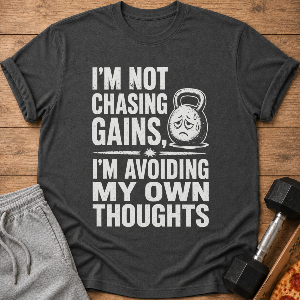 Dark gray t-shirt with "I'm Not Chasing Gains, I'm Avoiding My Own Thoughts" text.