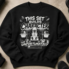 Black sweatshirt with "THIS SET BUILDS CHARACTER UNFORTUNATELY" graphic.
