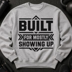 Grey sweatshirt with black text "BUILT FOR MOSTLY SHOWING UP".