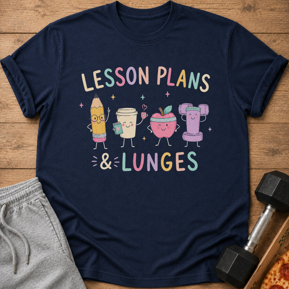 Navy t-shirt with "Lesson Plans & Lunges" text and cartoon pencil, coffee, apple, and dumbbell.