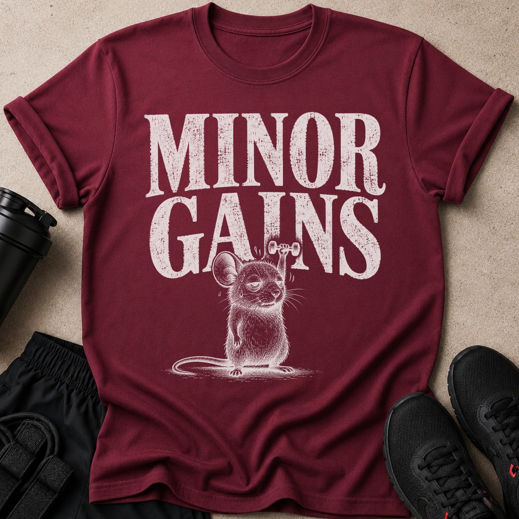 Maroon t-shirt with "Minor Gains" text and a humorous mouse lifting weights graphic.