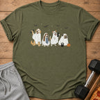 Four dogs in ghost costumes holding weights with bats in the sky.