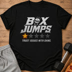 Black t-shirt with "Box Jumps" text, skull graphic, one yellow star, and "Trust Issues With Shins."
