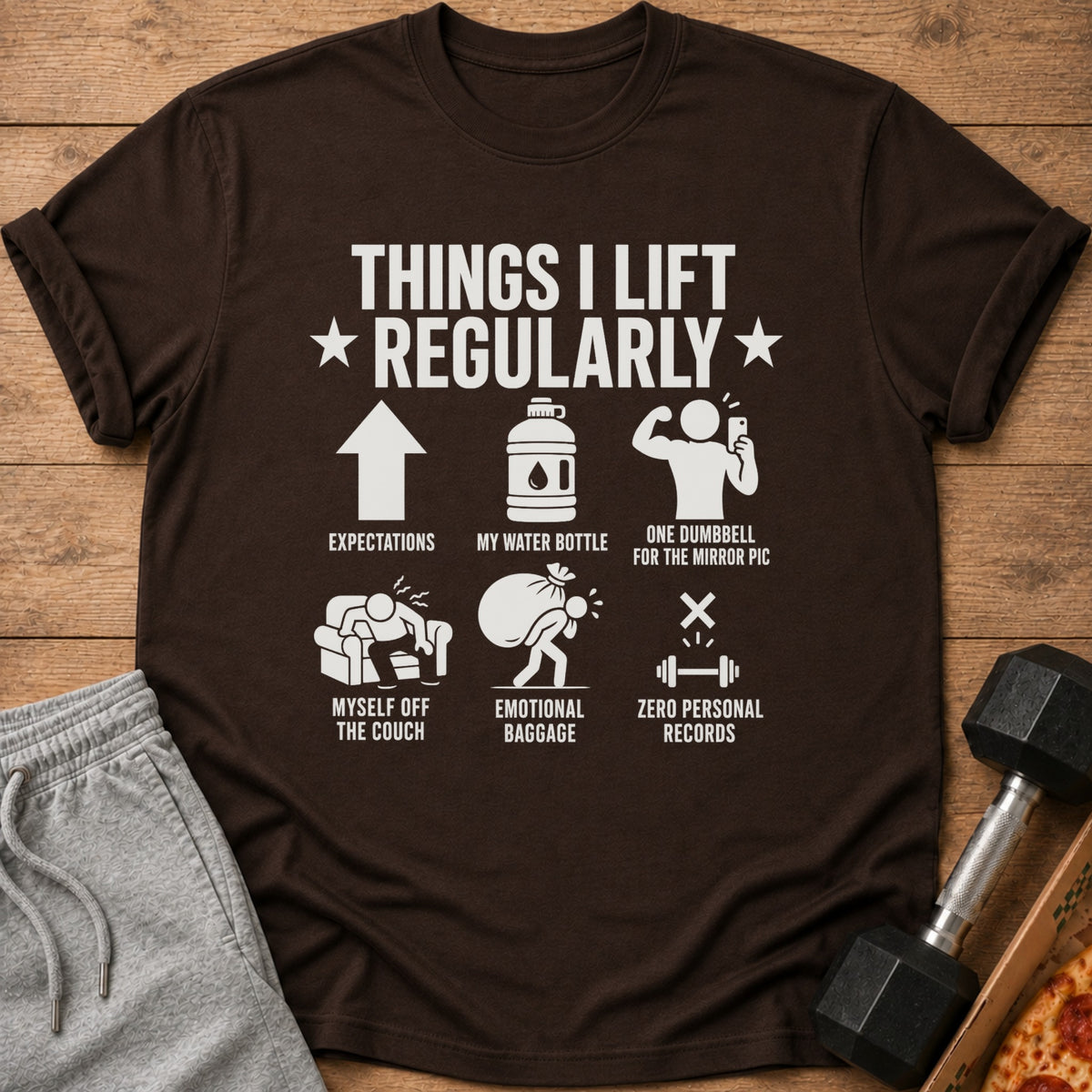 Brown t-shirt with "Things I Lift Regularly" and humorous fitness-related icons and text.