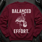 Maroon sweatshirt with a flamingo lifting a kettlebell and text "BALANCED EFFORT."