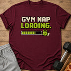 Maroon t-shirt with "GYM NAP LOADING." text and sleeping dumbbell graphic.