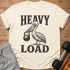 T-shirt with a pelican holding a kettlebell and text "HEAVY LOAD."