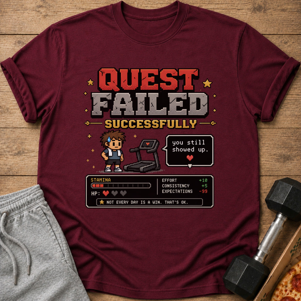 Maroon t-shirt with pixel art saying "QUEST FAILED SUCCESSFULLY" and fitness stats.