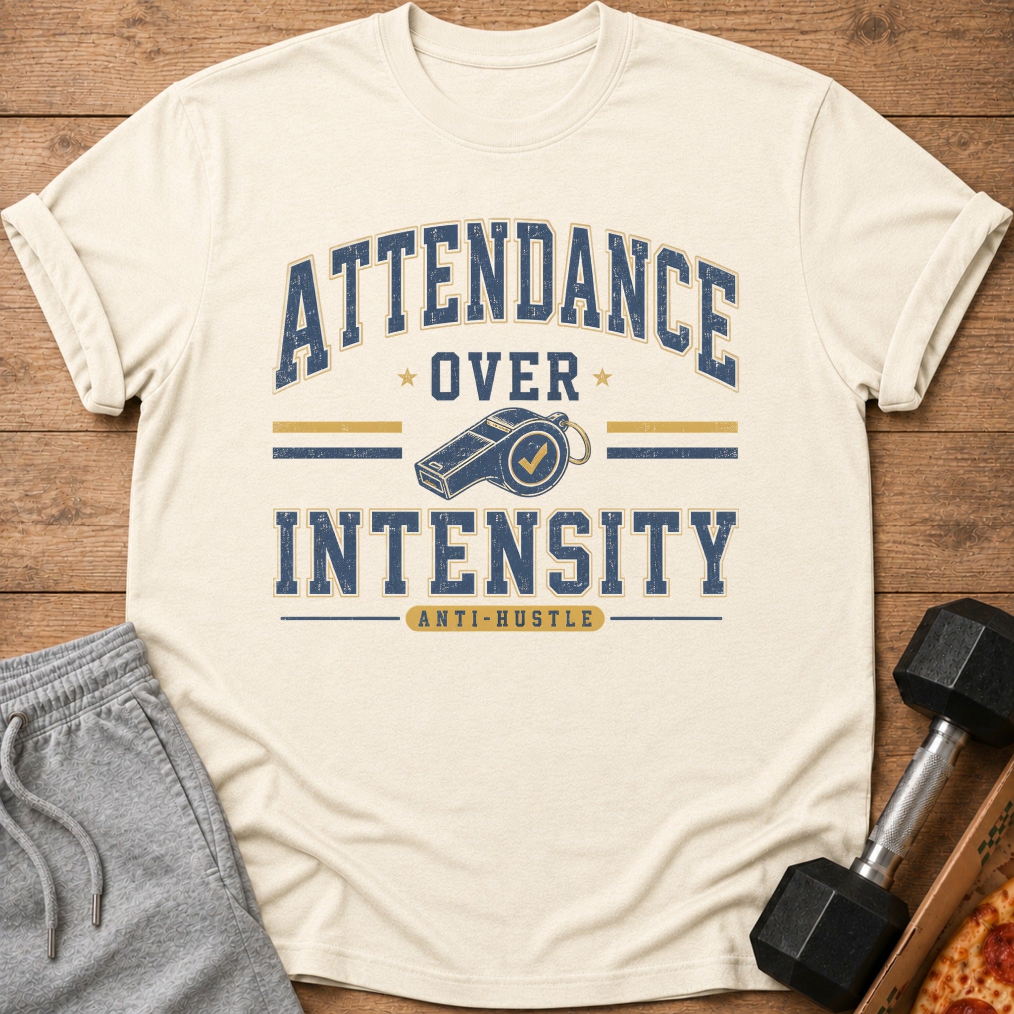 Cream t-shirt with "Attendance Over Intensity Anti-Hustle" graphic and whistle.