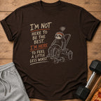 Brown t-shirt with sloth graphic and text "I'm not here to be the best. I'm here to feel a little less worst."