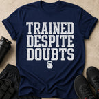 Navy t-shirt with "TRAINED DESPITE DOUBTS" and kettlebell graphic.