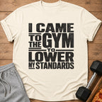 Off-white t-shirt with black text reading "I came to the gym to lower my standards."