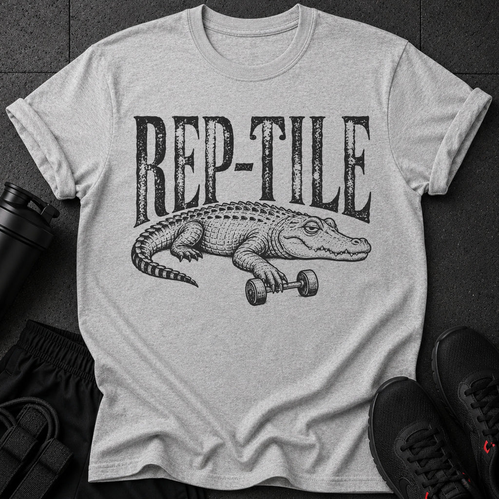 Grey t-shirt with black graphic text "REP-TILE" and a crocodile lifting a barbell.