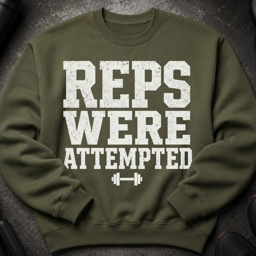 Green sweatshirt with distressed white text and barbell graphic reading "REPS WERE ATTEMPTED."