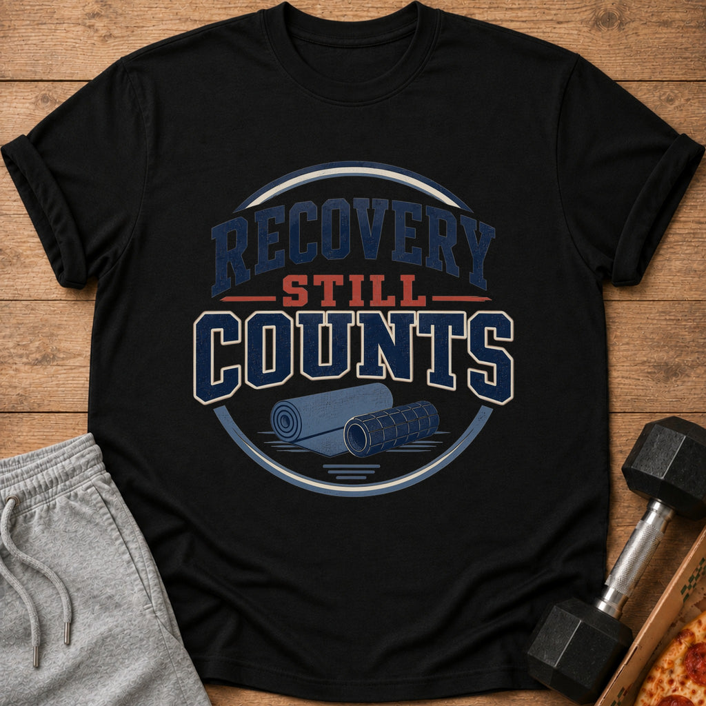 Black t-shirt with "Recovery Still Counts" text and gym equipment graphic.
