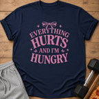 Navy t-shirt with pink text "EVERYTHING HURTS AND I'M HUNGRY"