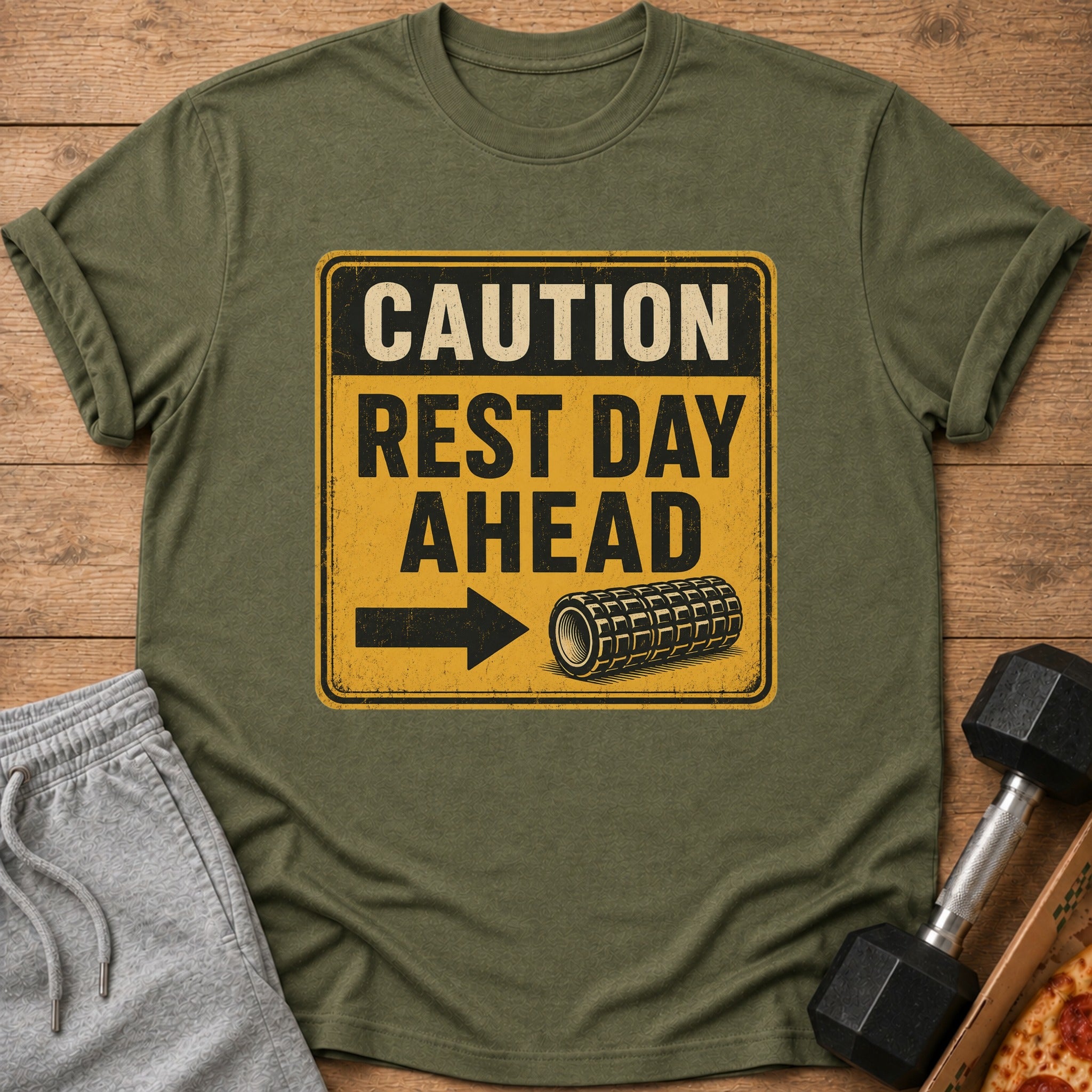 Green t-shirt with "CAUTION REST DAY AHEAD" text and a foam roller graphic.
