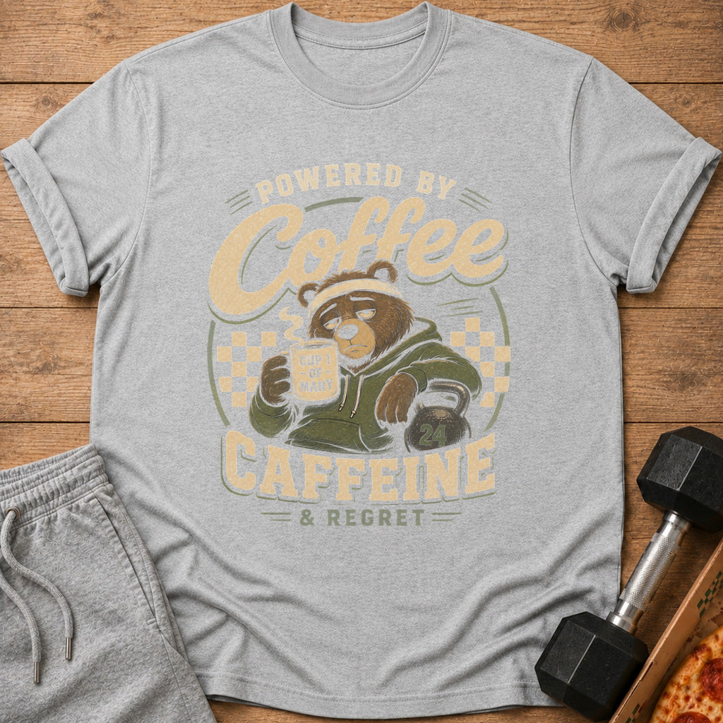 Gray t-shirt graphic of a bear holding coffee and text "POWERED BY COFFEE & REGRET".