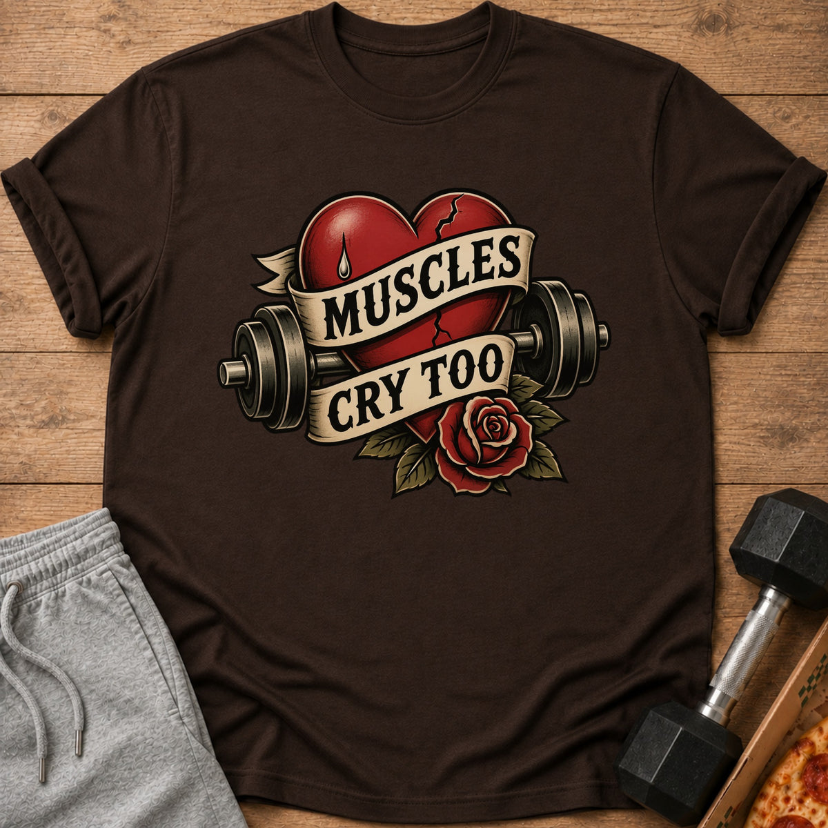 Brown t-shirt with distressed heart, barbell, rose, and text "Muscles Cry Too".