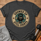 Kettlebell graphic on t-shirt reads "Showed Up Still Counts".