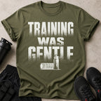 Olive green t-shirt with "TRAINING WAS GENTLE" graphic, water bottle, foam roller, shorts and shoes.