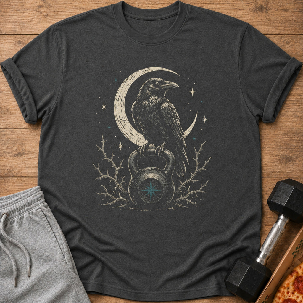 Dark t-shirt with raven perched on kettlebell under crescent moon and stars.