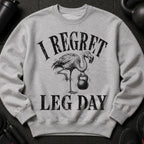 Grey sweatshirt with distressed print of flamingo holding kettlebell and text "I REGRET LEG DAY".