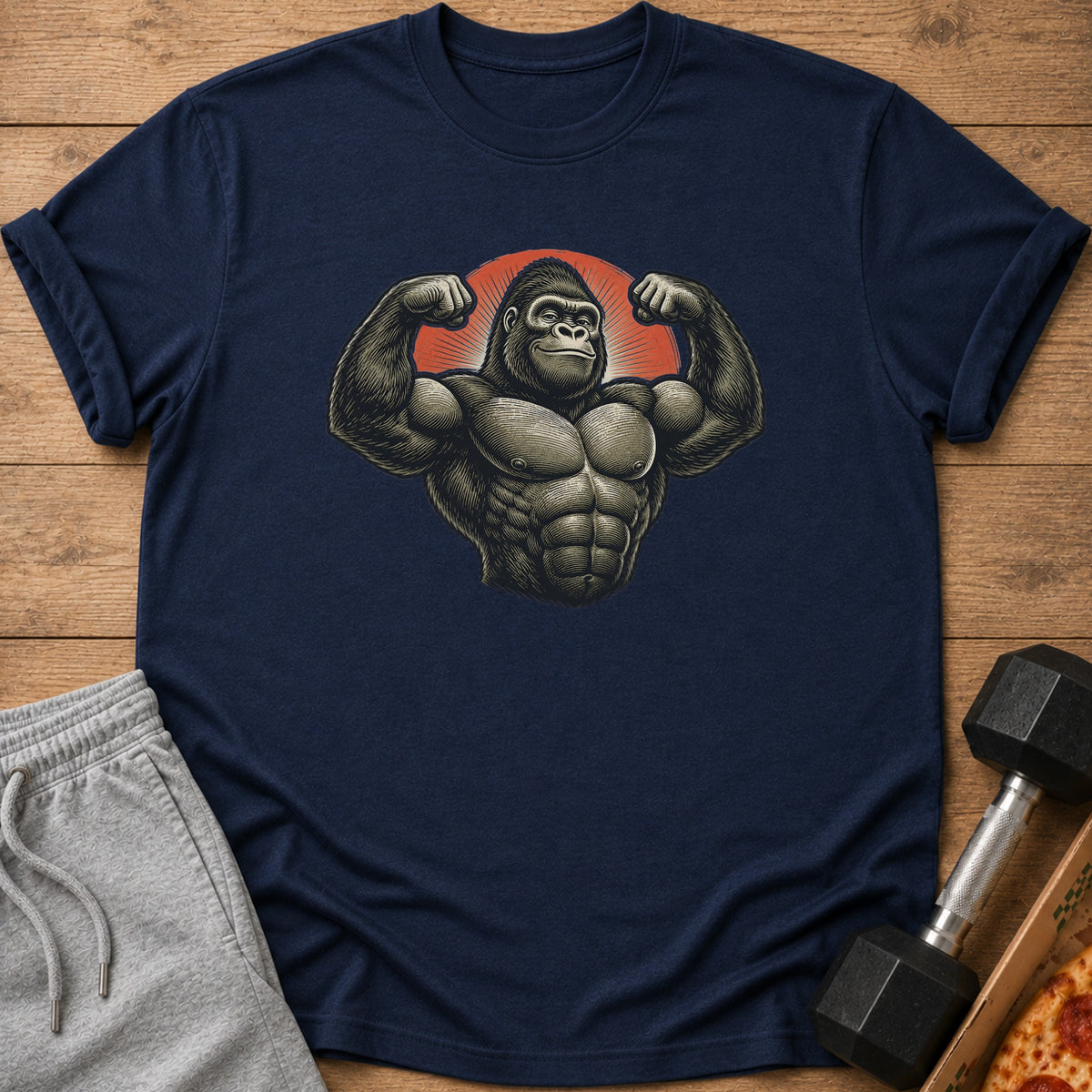 Dark blue t-shirt featuring a muscular gorilla flexing with a red sunburst background.