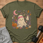 Tired ghost with headband sits near gym equipment and Halloween decorations.
