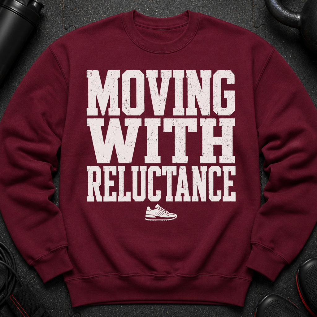 Maroon sweatshirt with white distressed text "MOVING WITH RELUCTANCE" and a sneaker graphic.