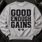 Grey sweatshirt with "GOOD ENOUGH GAINS" text and barbell graphic.