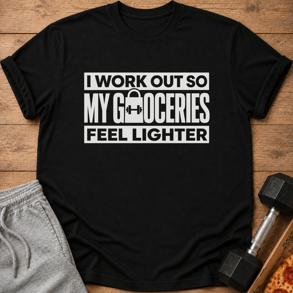 Black t-shirt with white text "I work out so my groceries feel lighter."