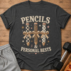 Graphic t-shirt with "PENCILS & PERSONAL BESTS" text and three decorative pencils.