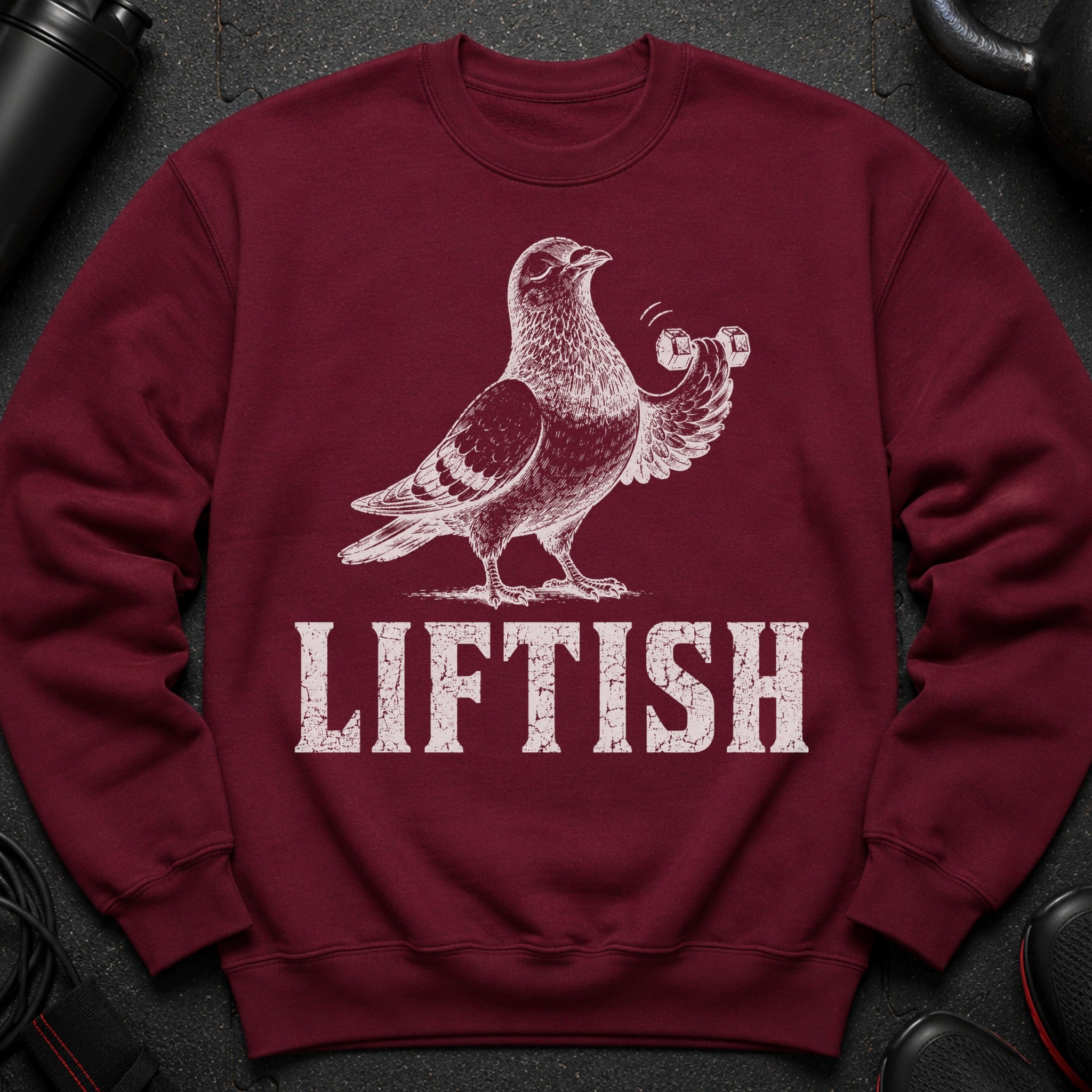 Maroon sweatshirt with white pigeon lifting dumbbells and "LIFTISH" text.