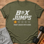 Green t-shirt with "BOX JUMPS TRUST ISSUES WITH SHINS" text and a cracked star.
