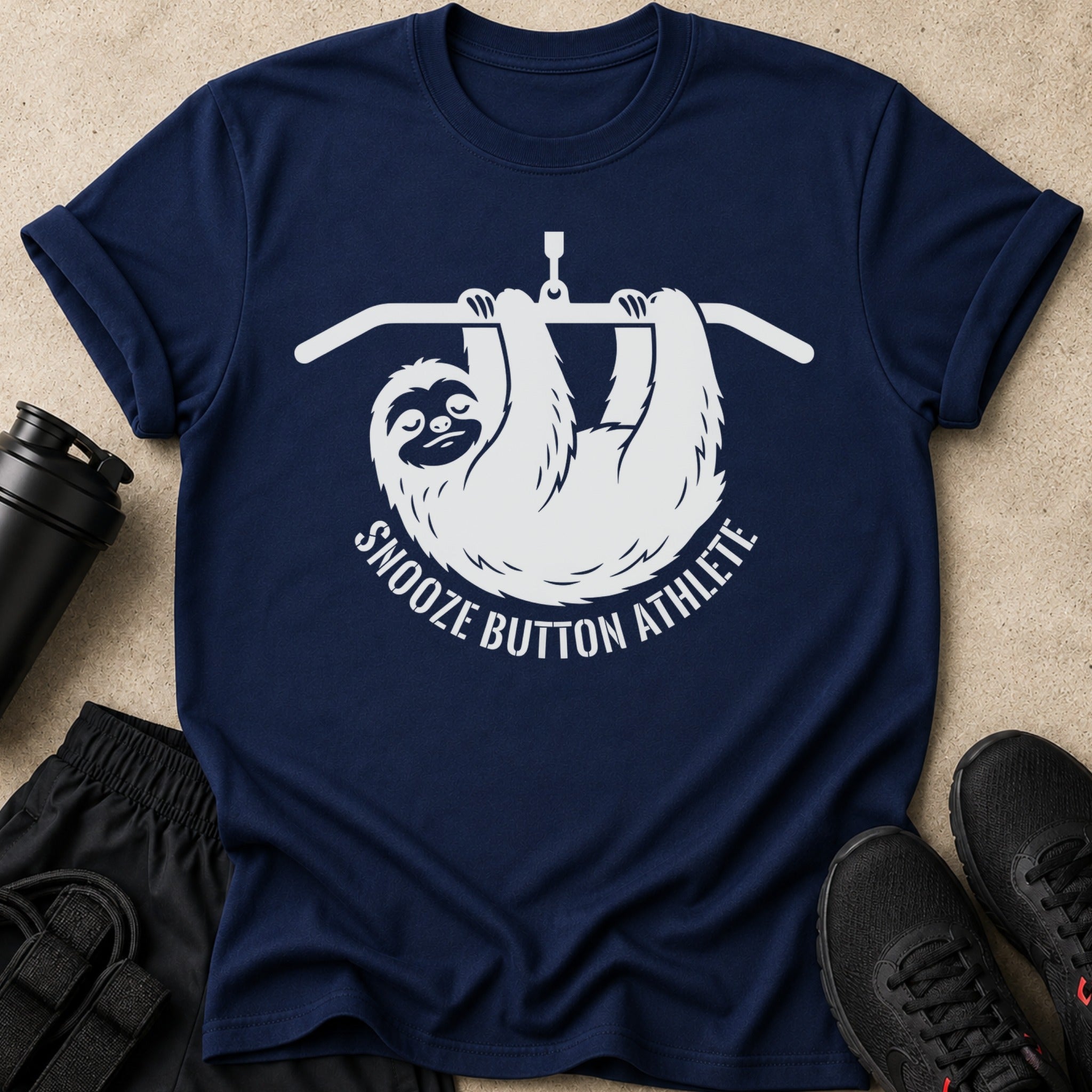 Navy t-shirt with white sloth graphic and text saying "Snooze Button Athlete".