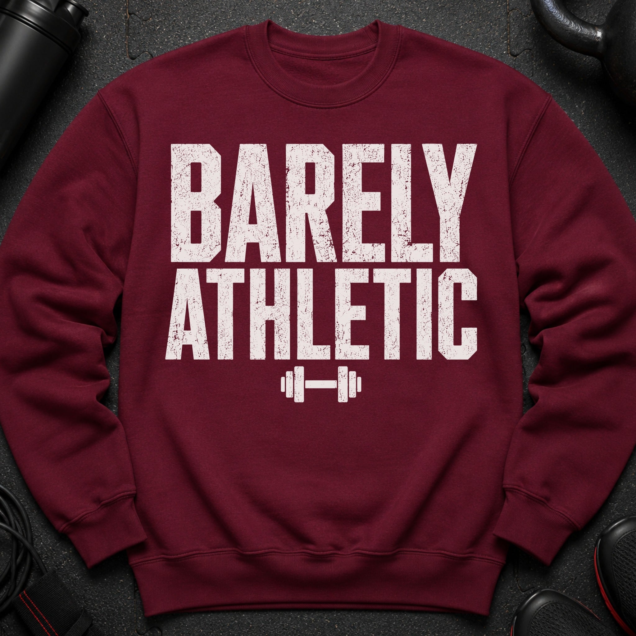 Maroon sweatshirt with "BARELY ATHLETIC" and dumbbell graphic.