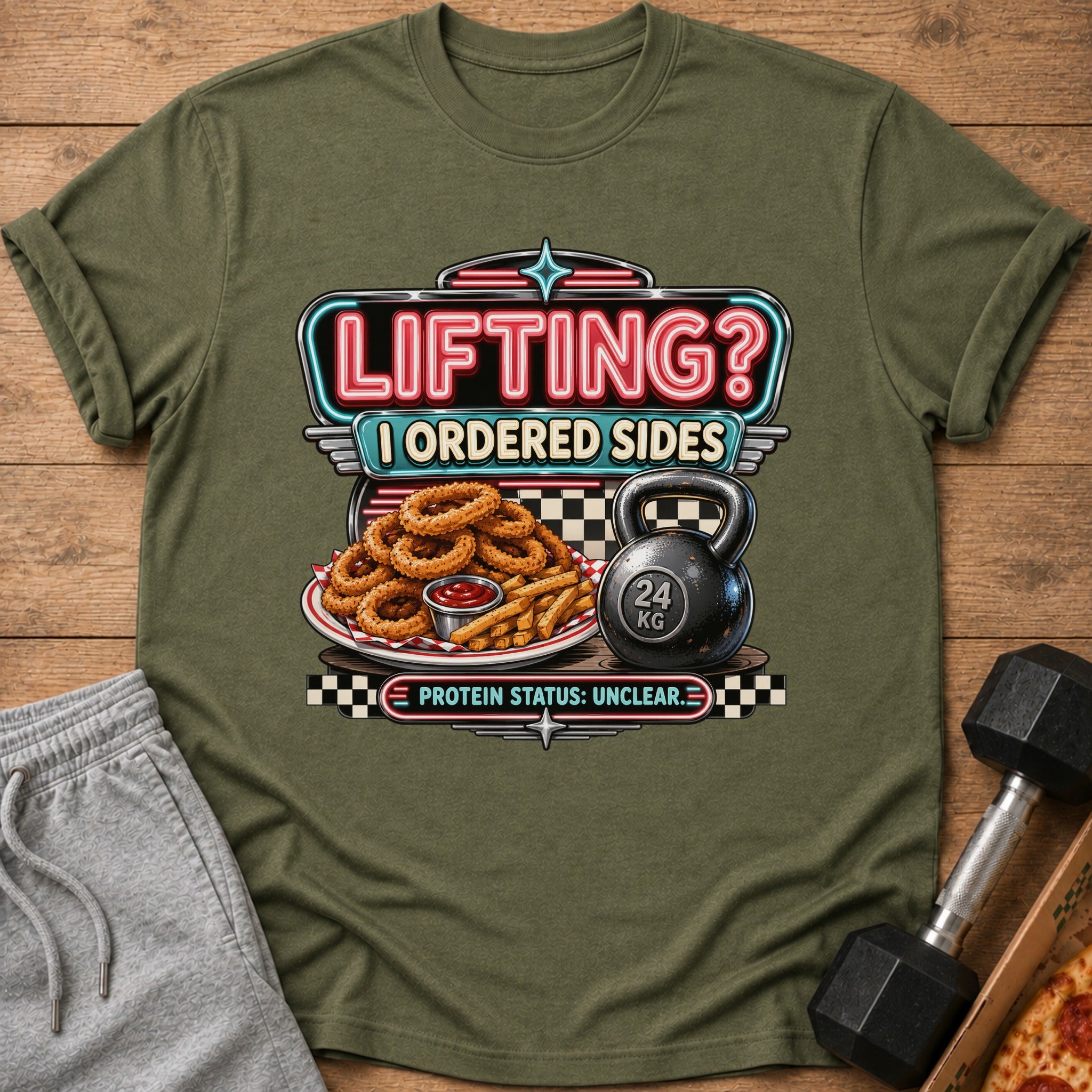 T-shirt graphic: "Lifting? I Ordered Sides" with onion rings, fries, a kettlebell, and "Protein Status: Unclear."