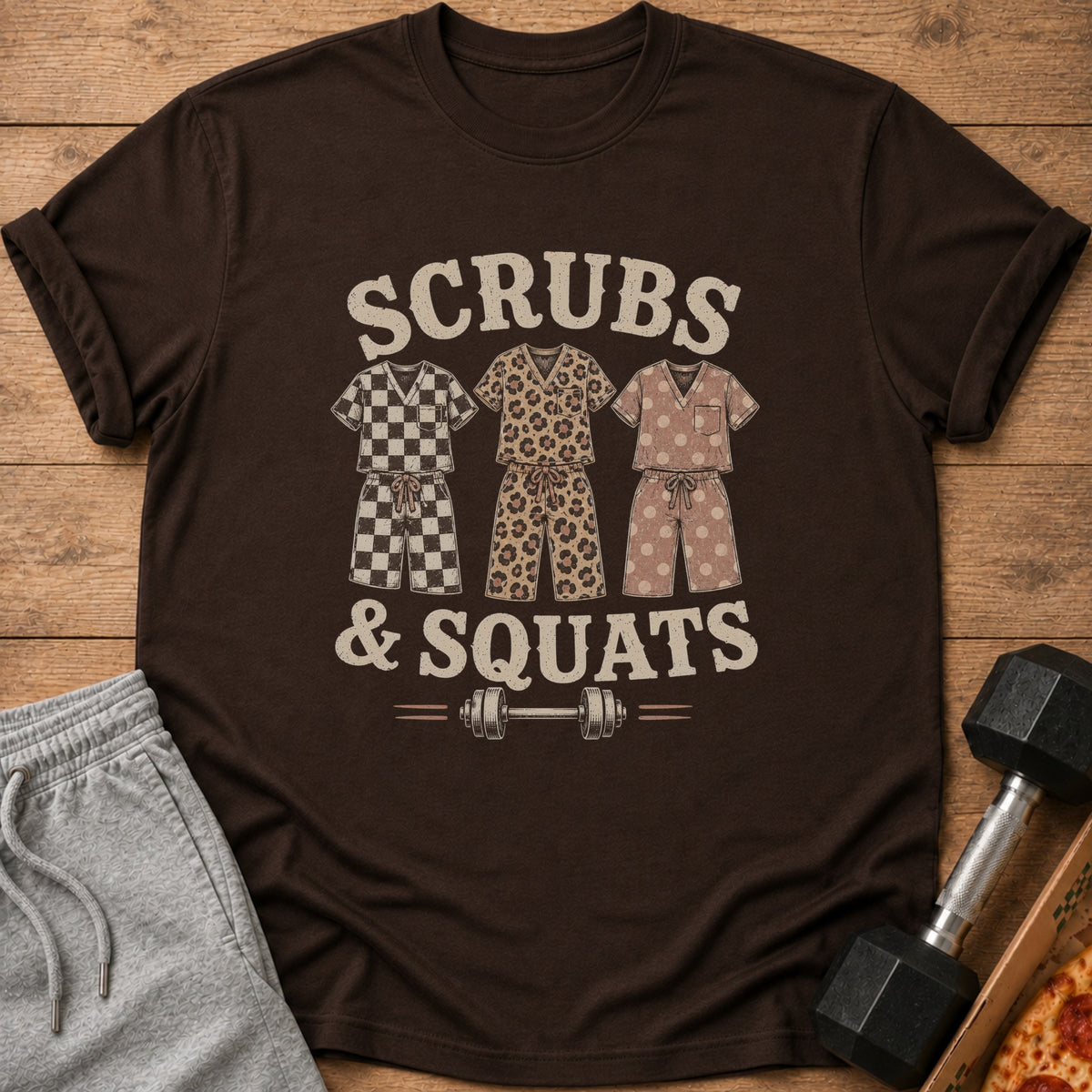 Brown t-shirt with "Scrubs & Squats" text and three scrub sets.